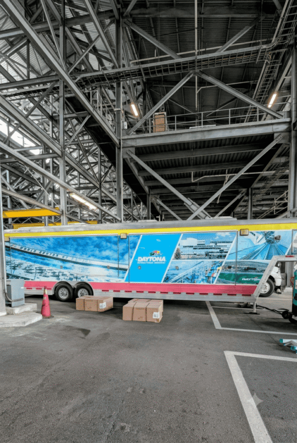 Daytona-branded trailer under industrial steel structure